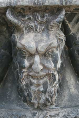 Stone carving of demon